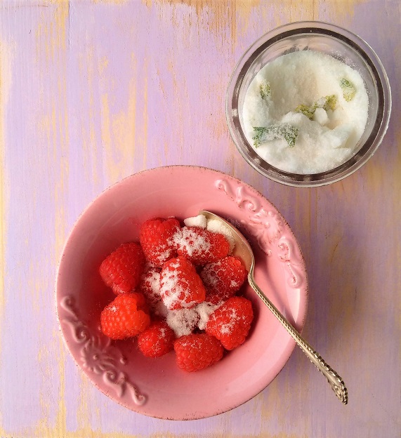 Rose_geranium_sugar_sprinkled_over_fresh_raspberries