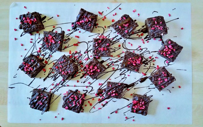 Drizzled_with_chocolate_and_scattered_with_raspberry_pieces_vegan_chocolate_brownies
