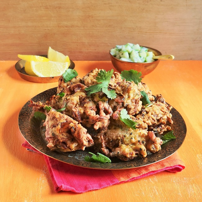 Pile_of_courgette_and_leek_bhajis_sprinkled_with_coriander