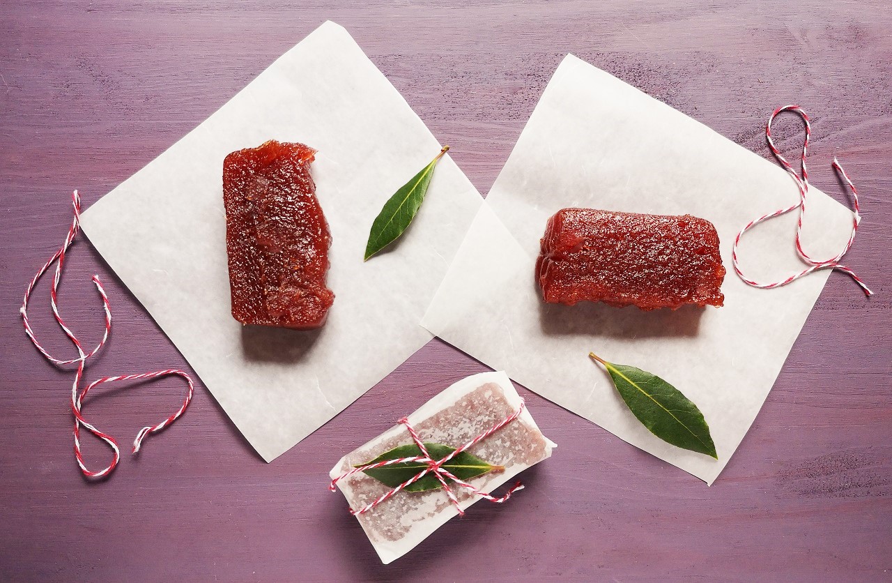 Slices_of_plum_membrillo_being_wrapped_in_waxed_paper