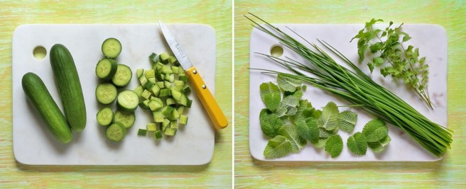 Mini_Munch_cucumbers_mint_leaves, fresh_chives_and_sprigs_of_salad_burnet_on_a_marble_chopping_board
