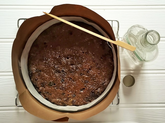 Skewering_hot_fruit_cake_and_spooning_over_rum