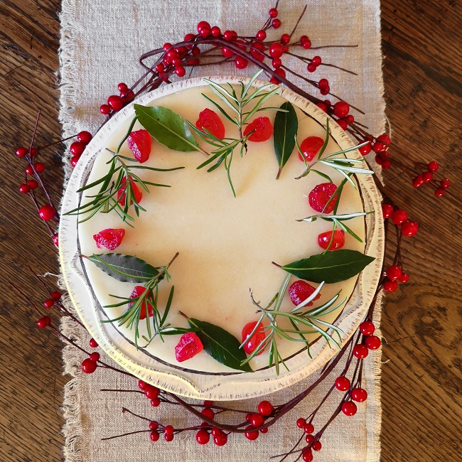 Overhead_image_of_a_marzipanned_vegan_fruit_cake_decorated_simply_for_Christmas