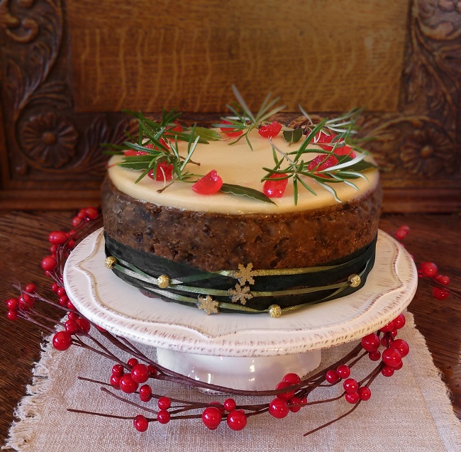 Vegan_gluten-free_fruit_cake_topped_with_marzipan_decorated_for_Christmas
