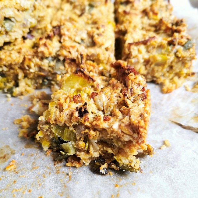 Close-up_on_a_piece_of_savoury_flapjack_with_seeds_and_leek